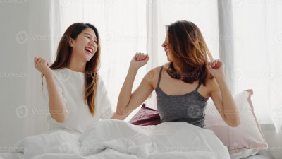 Ladies on Bed Laughing.jpg