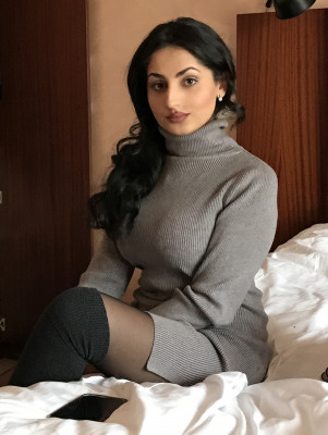 What scene is this photo from where she's sitting on the rumpled bed, Master?